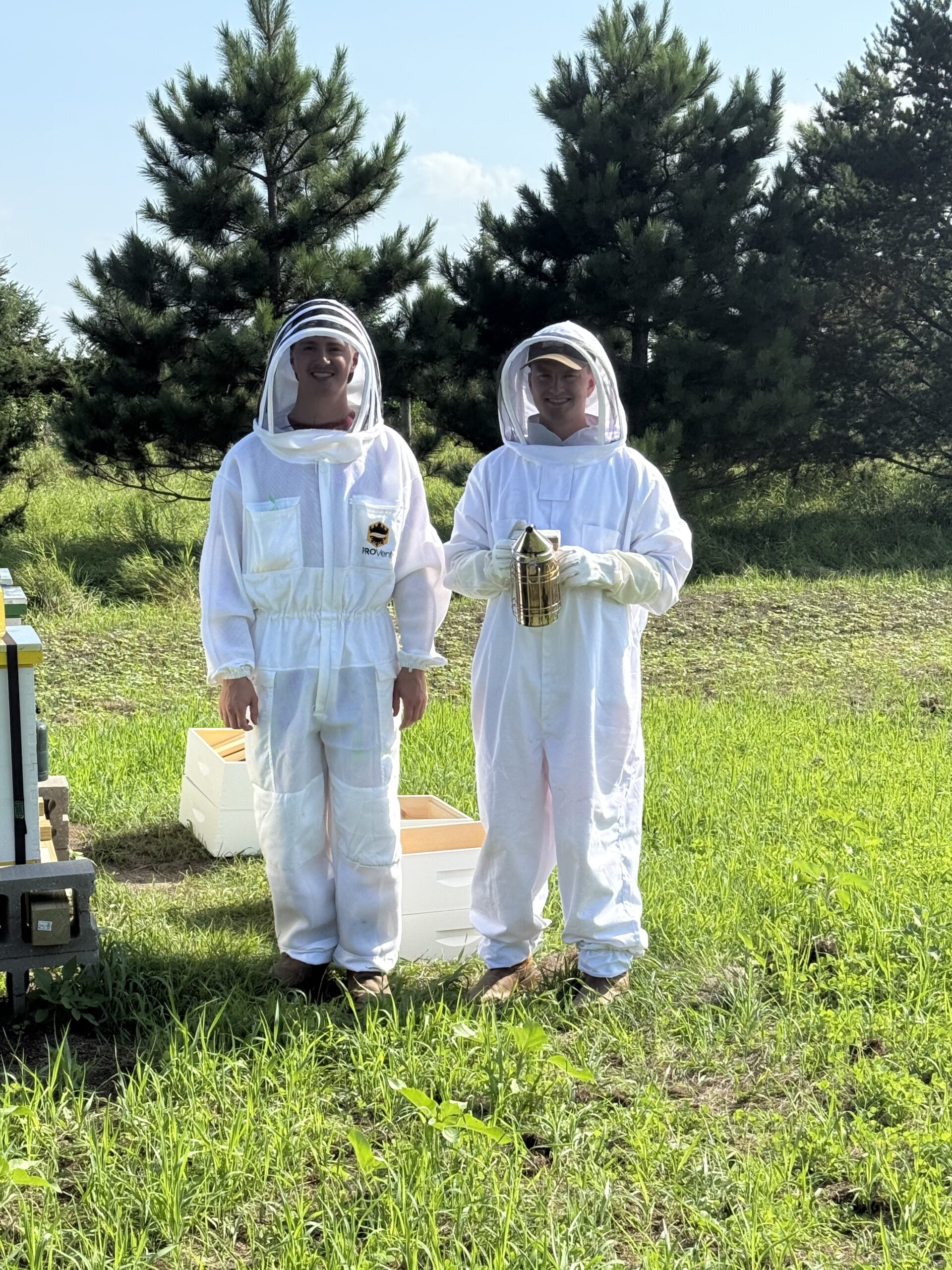 Connor and Carson working in the hives
